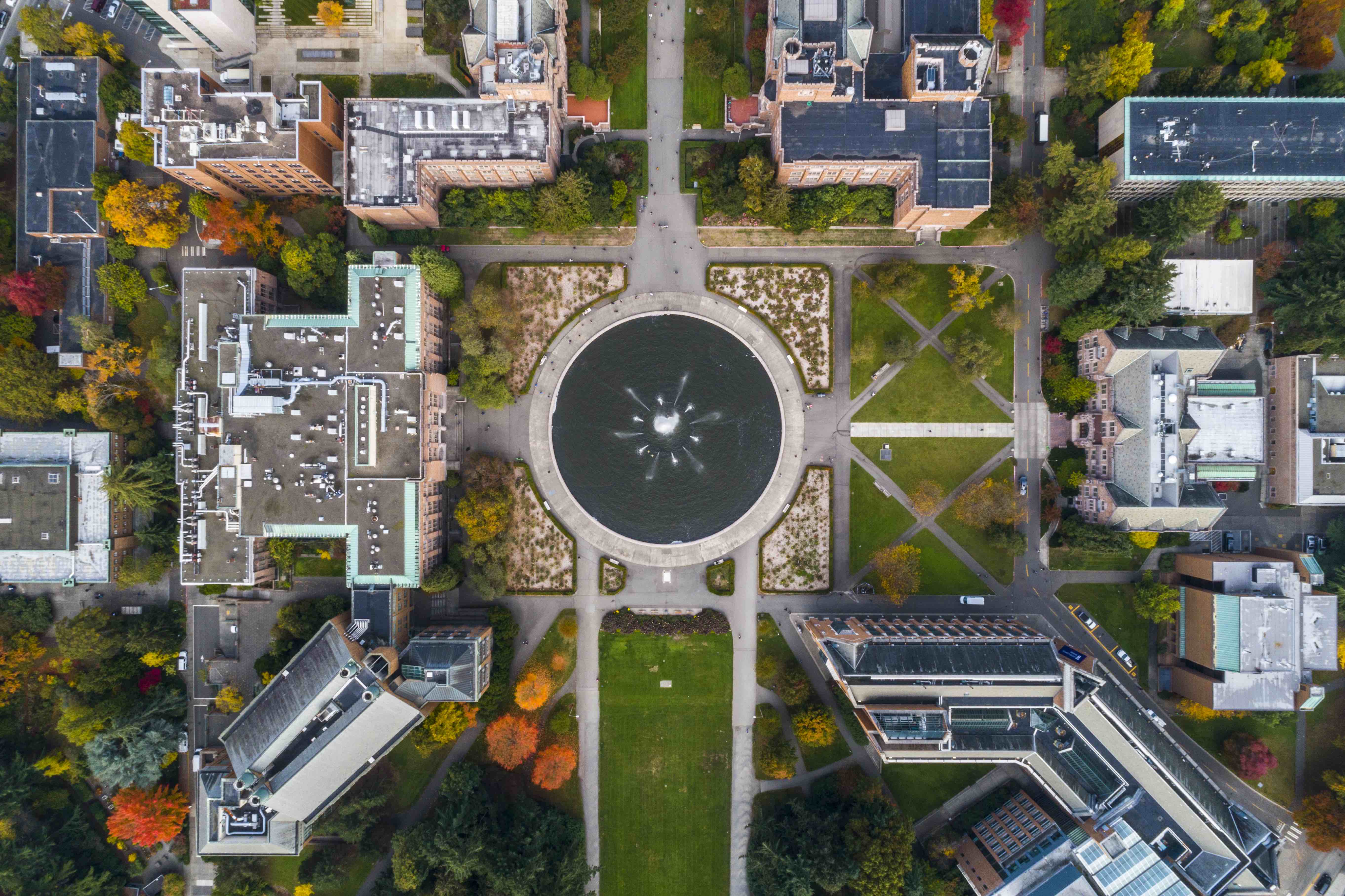 An arial view of the Univeristy of Washington featuring Drumheller Fountain in the center