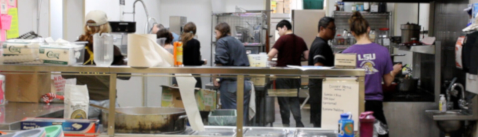 Residents stand in the kitchen during operation nightwatch