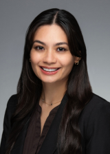 Headshot of Vanessa Freitas against a light gray background