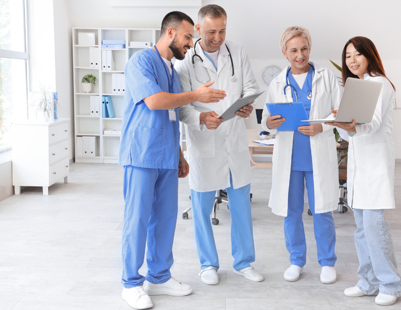 Doctors talking to each other in a huddle.