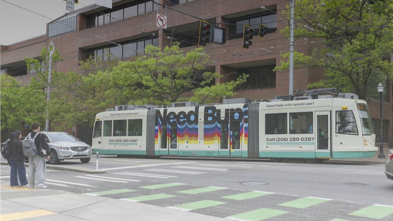 A street car wrapped in a 'Need Bup?' advertisement 