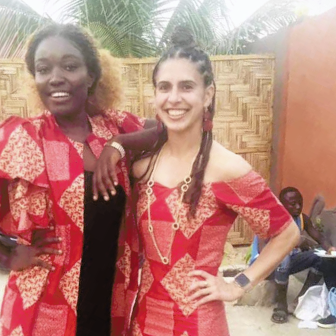 A former fellow poses with a Partners In Health representative