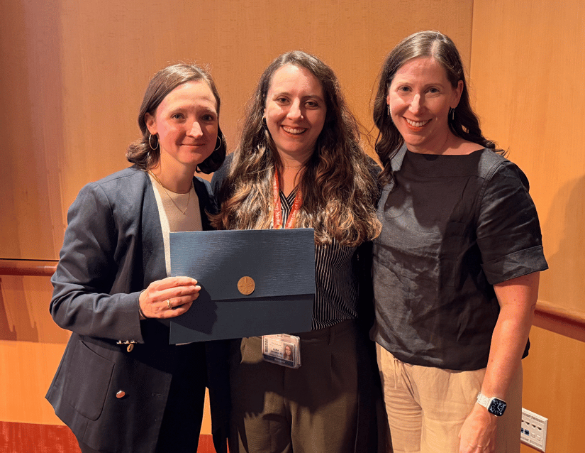 Dr. Kira Gressman (center) receives the Housestaff Award