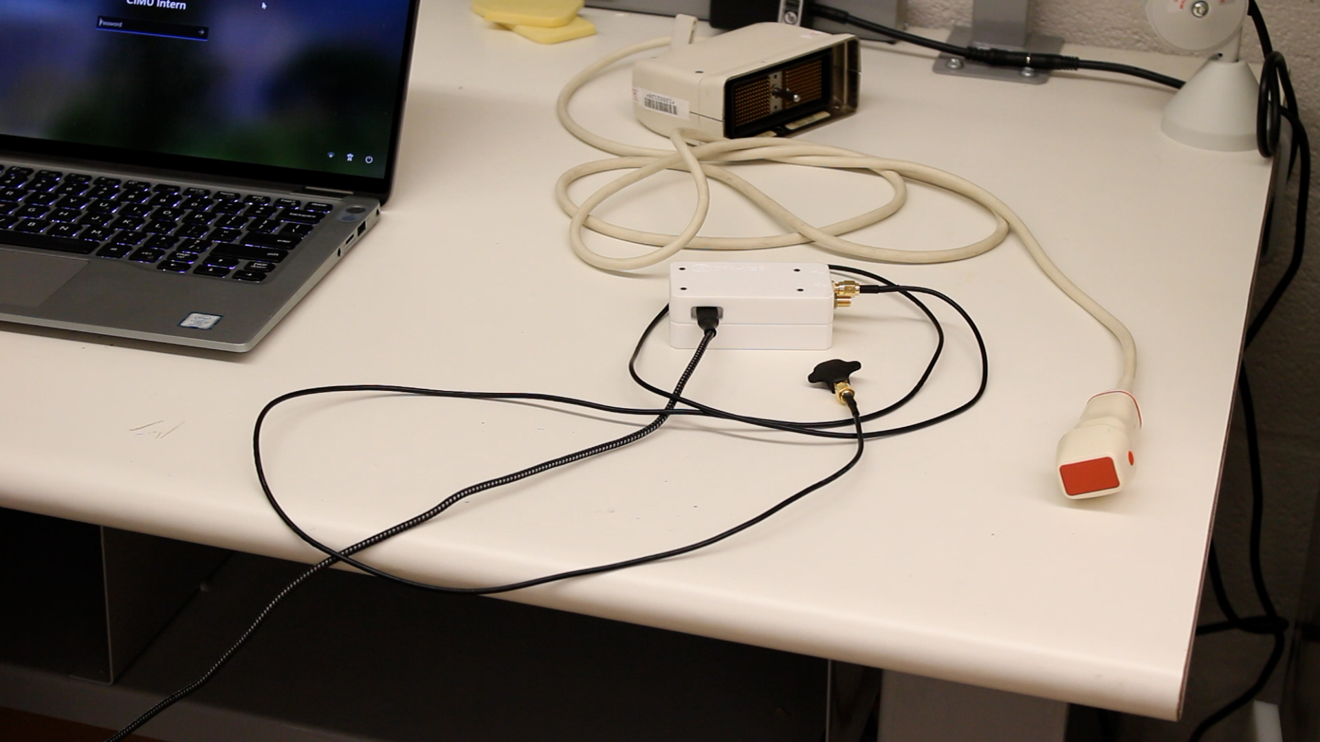 The LUSS device (left) compared to a standard ultrasound probe (right)